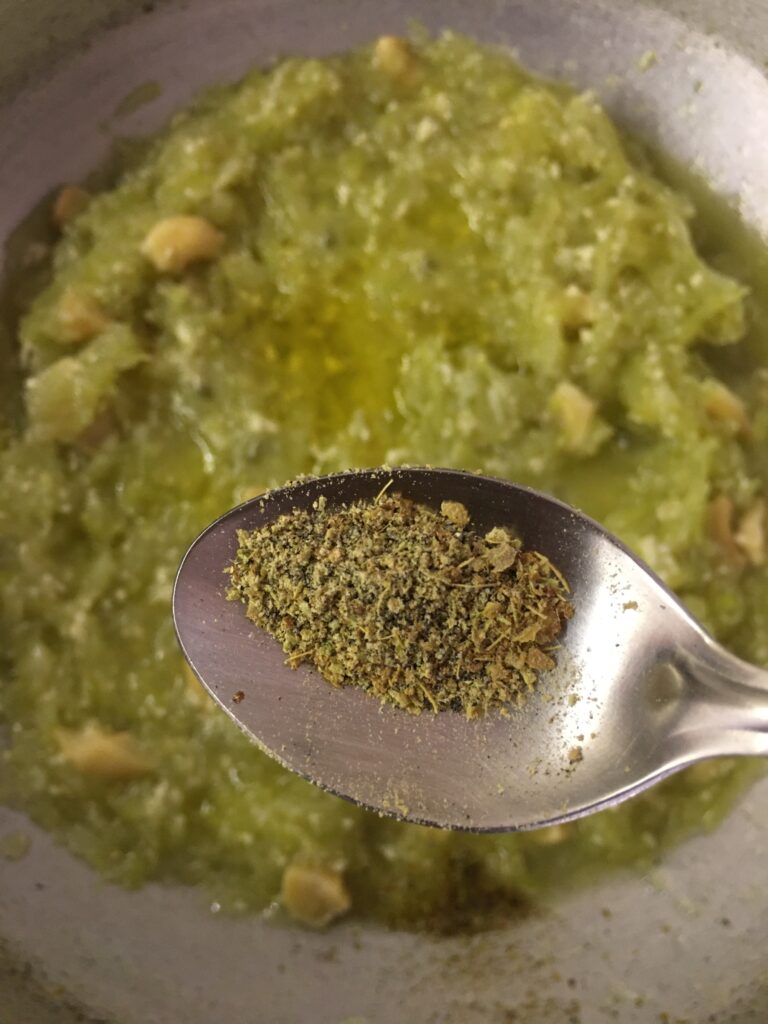 Adding cardamom powder