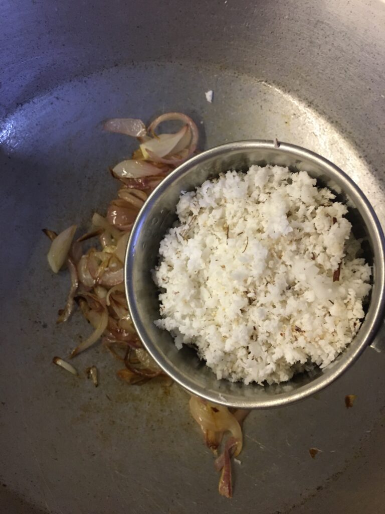 Adding grated coconut