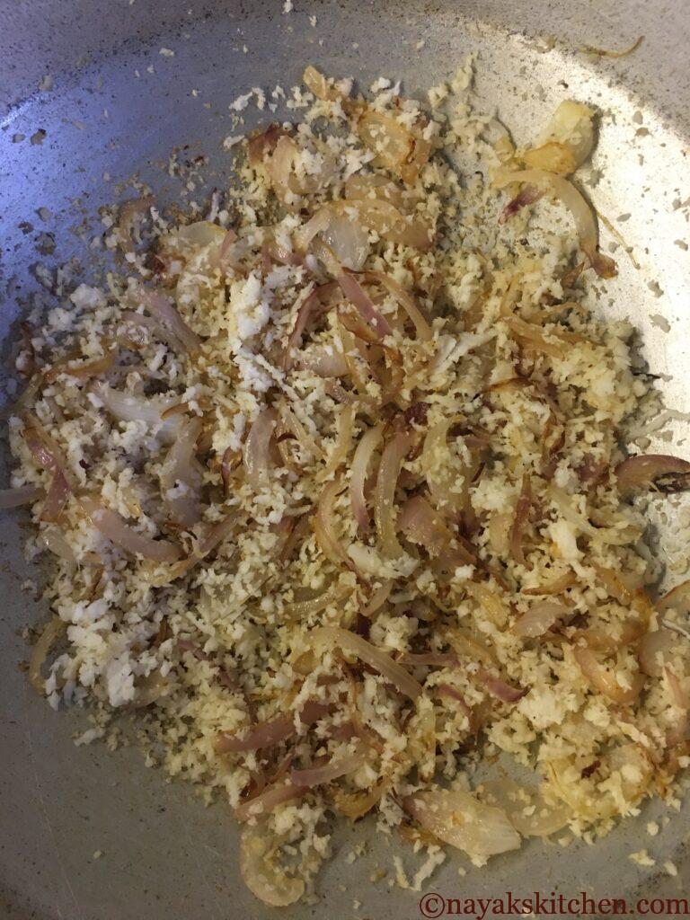 Roasting grated coconut till golden brown