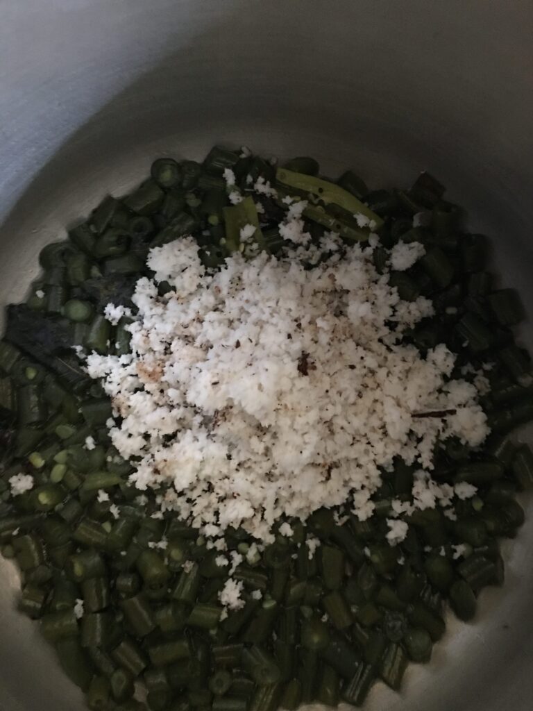 Adding freshly grated coconut
