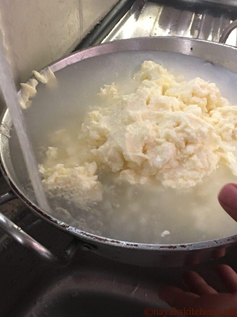 Washing butter under running water