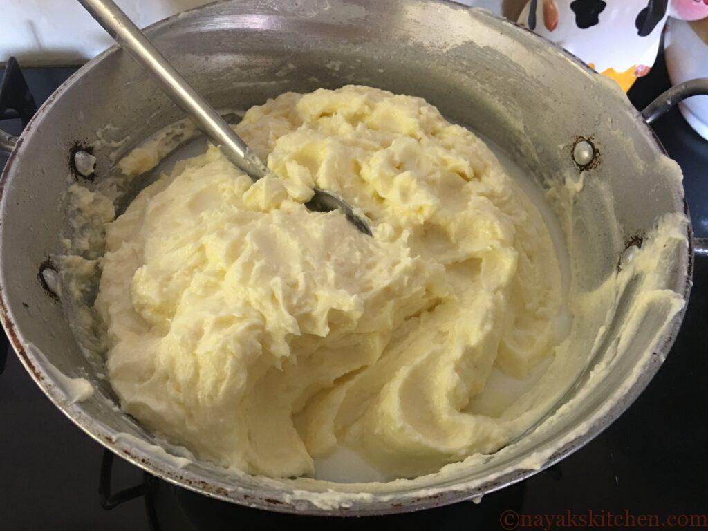 Placing vessel with collected butter on gas