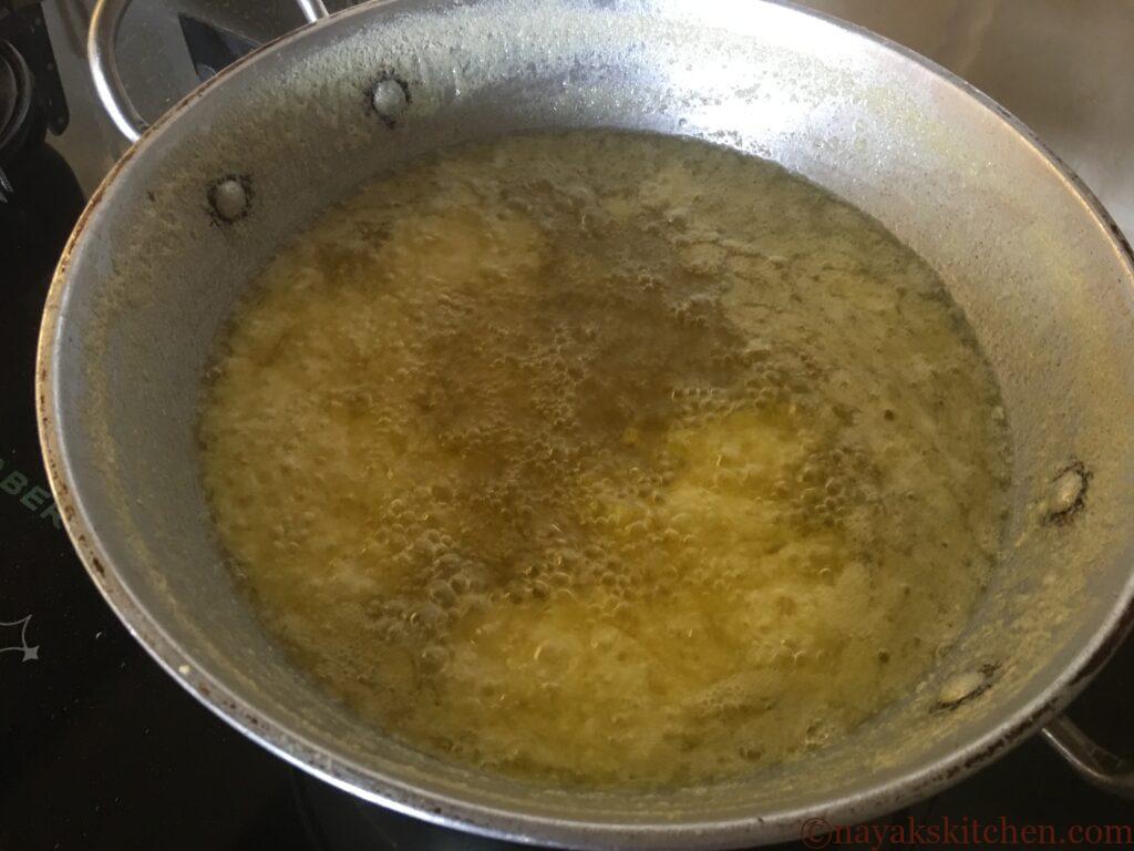 Butter starts clearing to form ghee