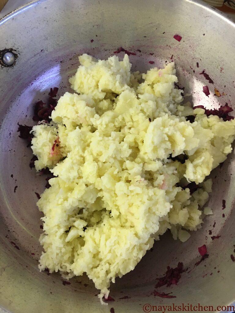Adding boiled and grated/mashed potato