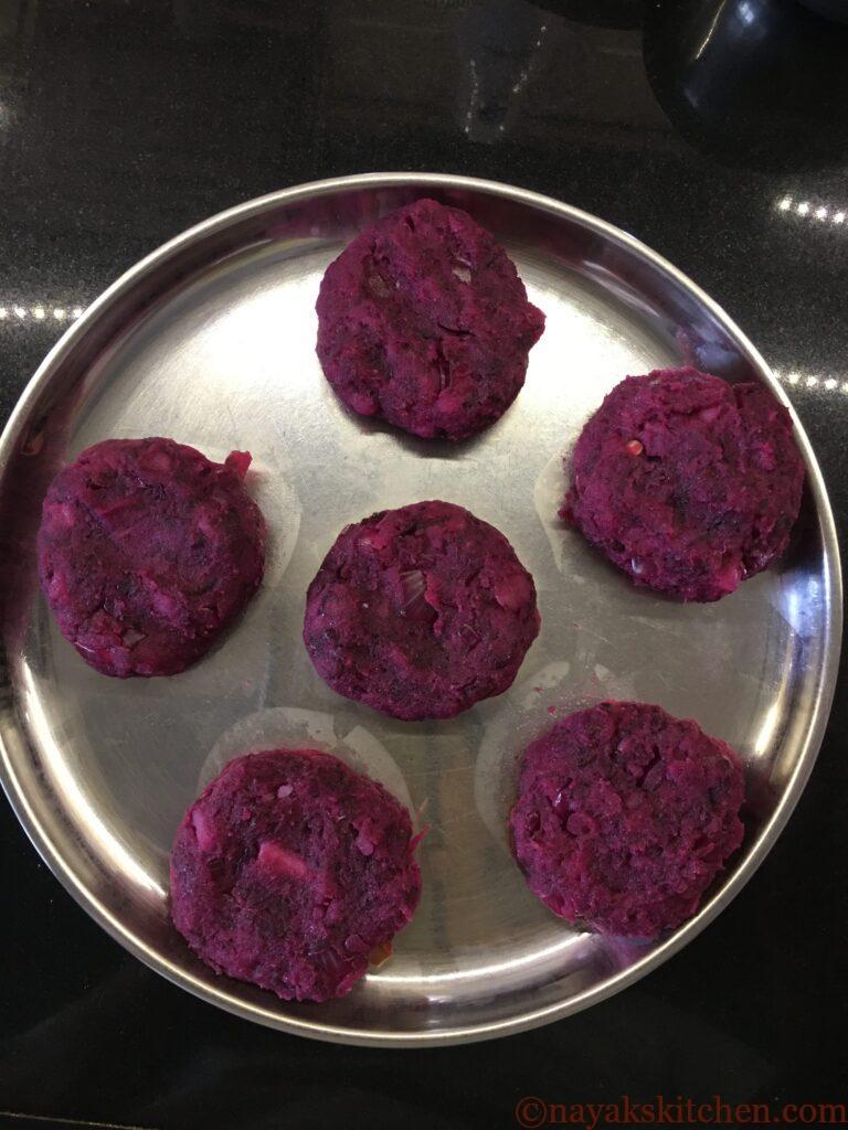 Shaping beetroot-potato mixture into cutlets