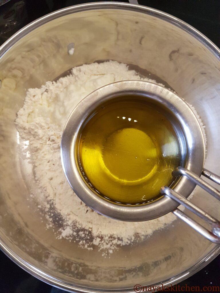 Adding ghee to mixture