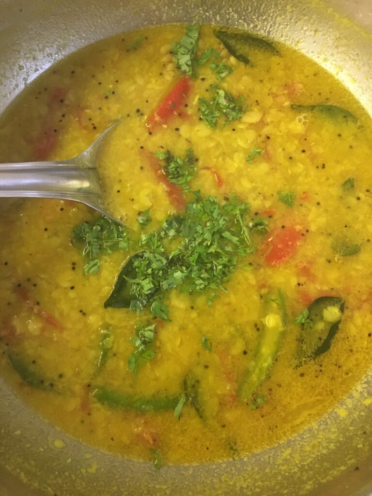 Adding chopped coriander leaves