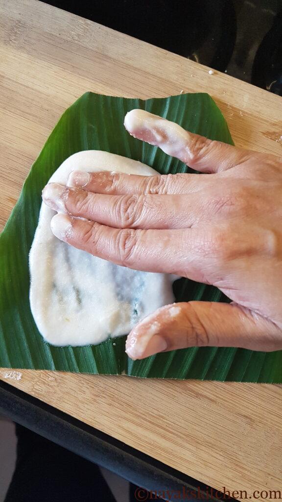 Spreading the batter on turmeric leaves