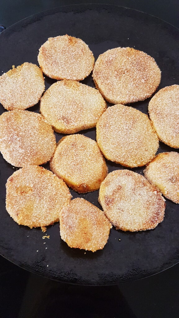 Frying potatoes on tava