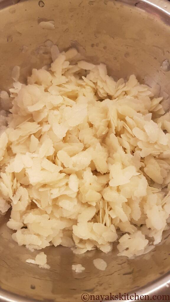 Washing the beaten rice with water