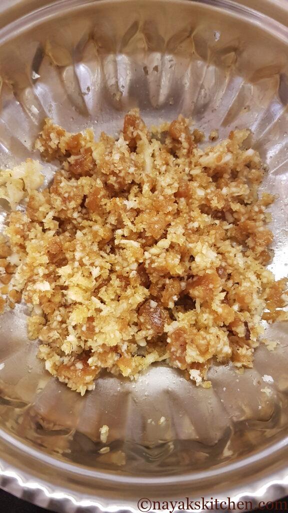 Mixing coconut and jaggery