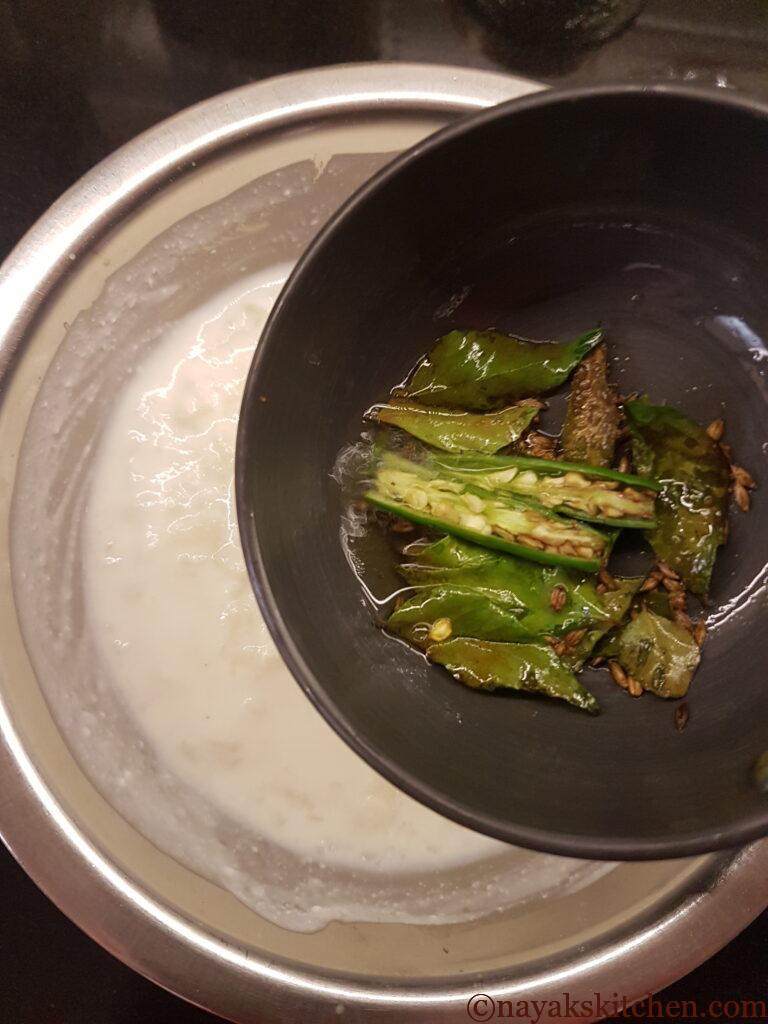 Tempering curd-beaten rice mixture