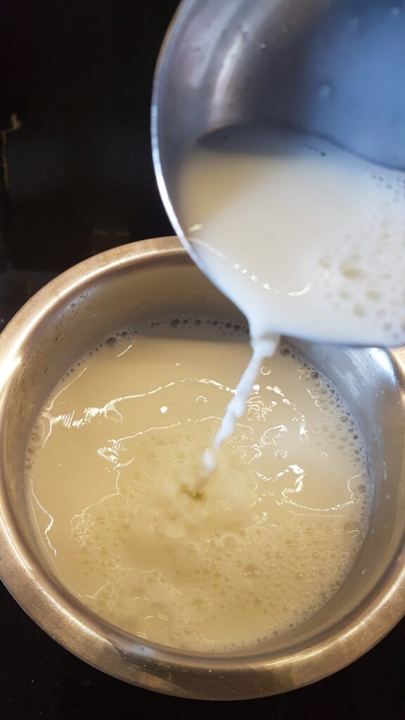 Frothing milk to and fro