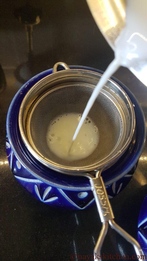 Straining milk to remove cream