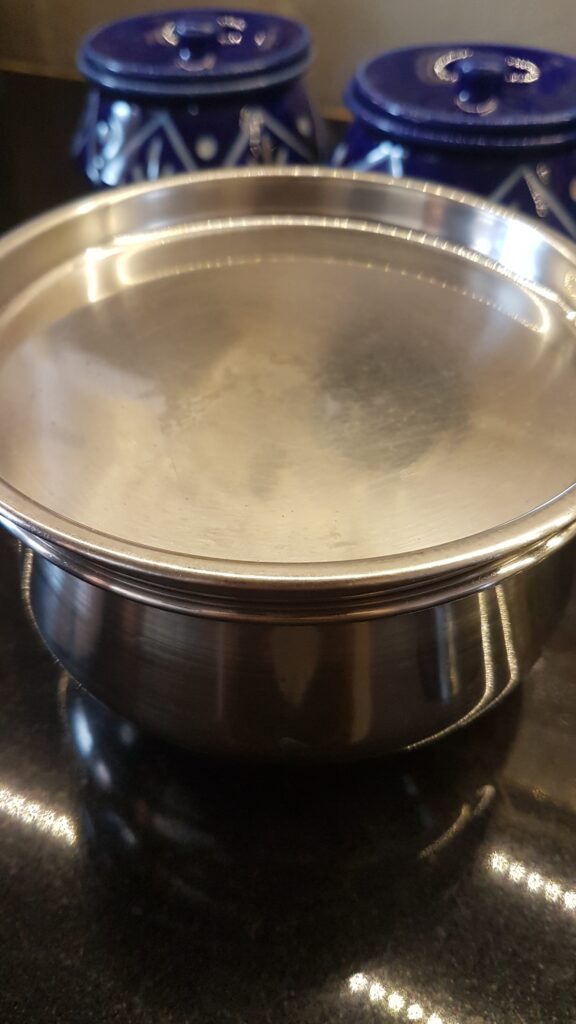 Keeping the steel container to set dahi