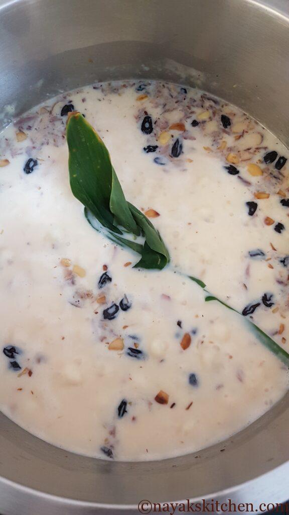 Cooking rice payasam with turmeric leaf