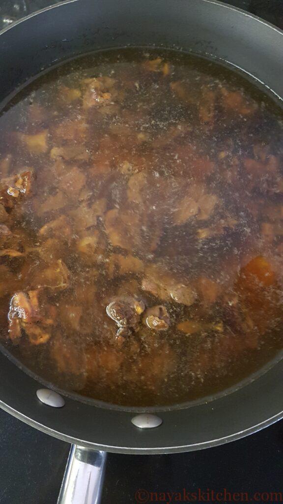 Placing tamarind-dates-jaggery on gas