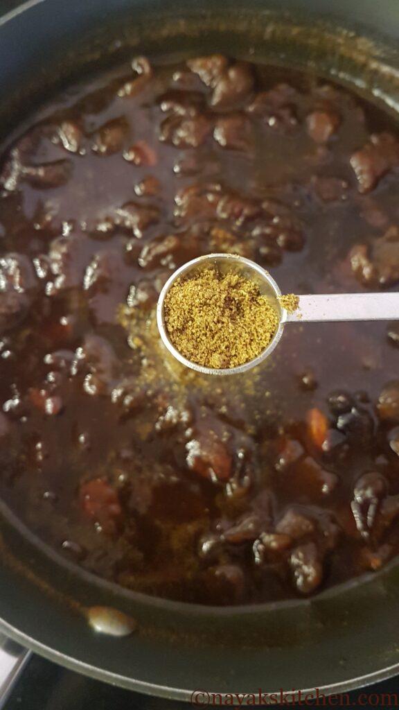 Adding cumin (jeera) powder