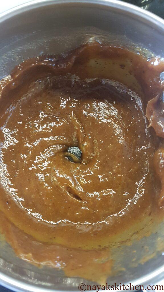 Grinding the mixture to a fine paste