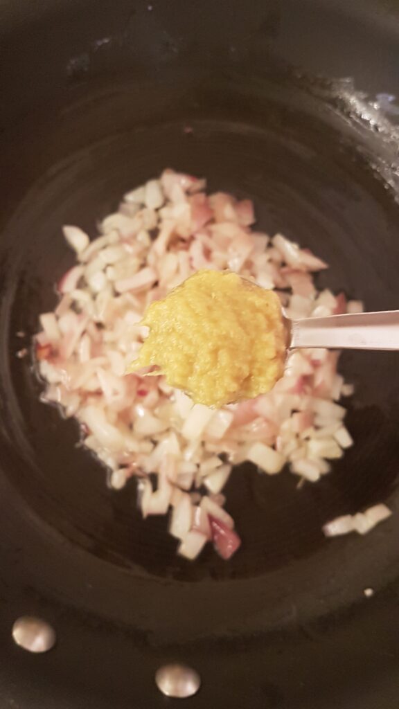 Adding ginger-garlic paste