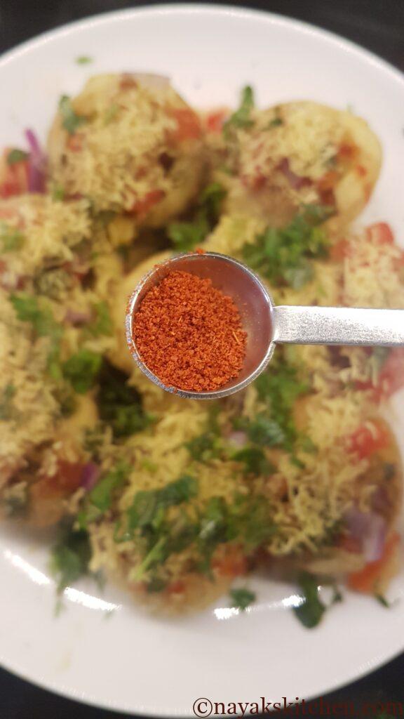 Sprinkling red chilli powder