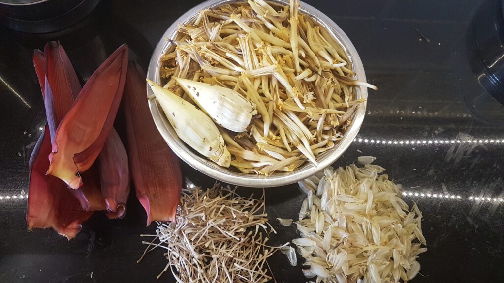 Cleaned banana flower with the discarded parts