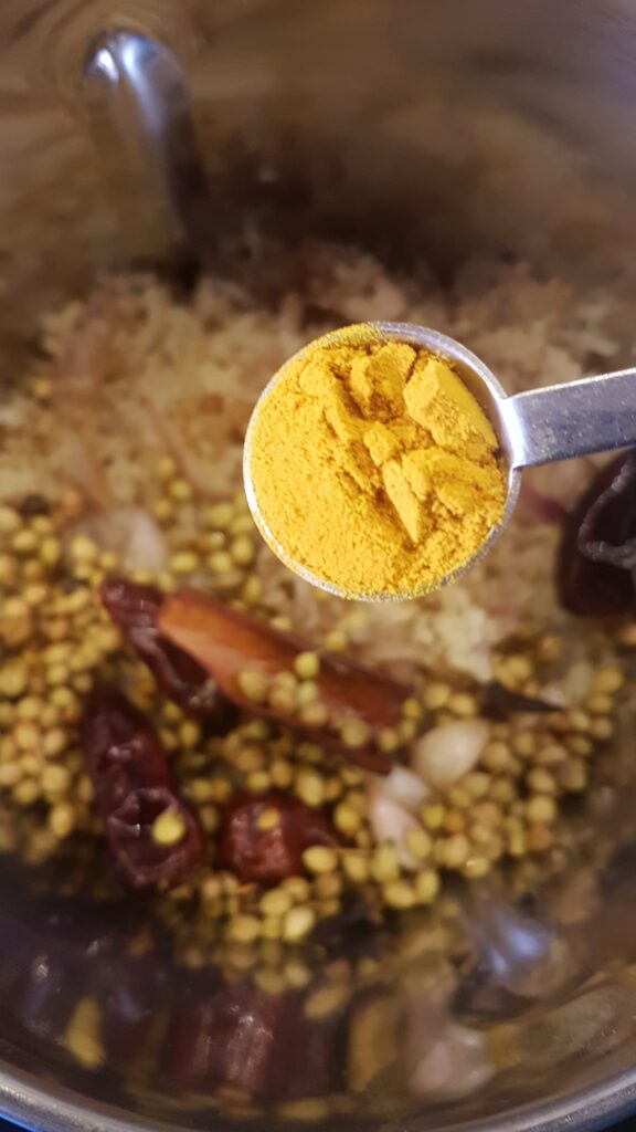 Adding turmeric powder