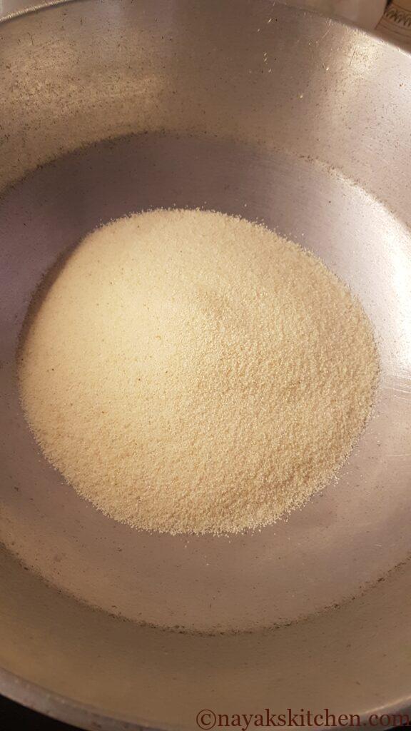 Adding rava (semolina) to heated ghee