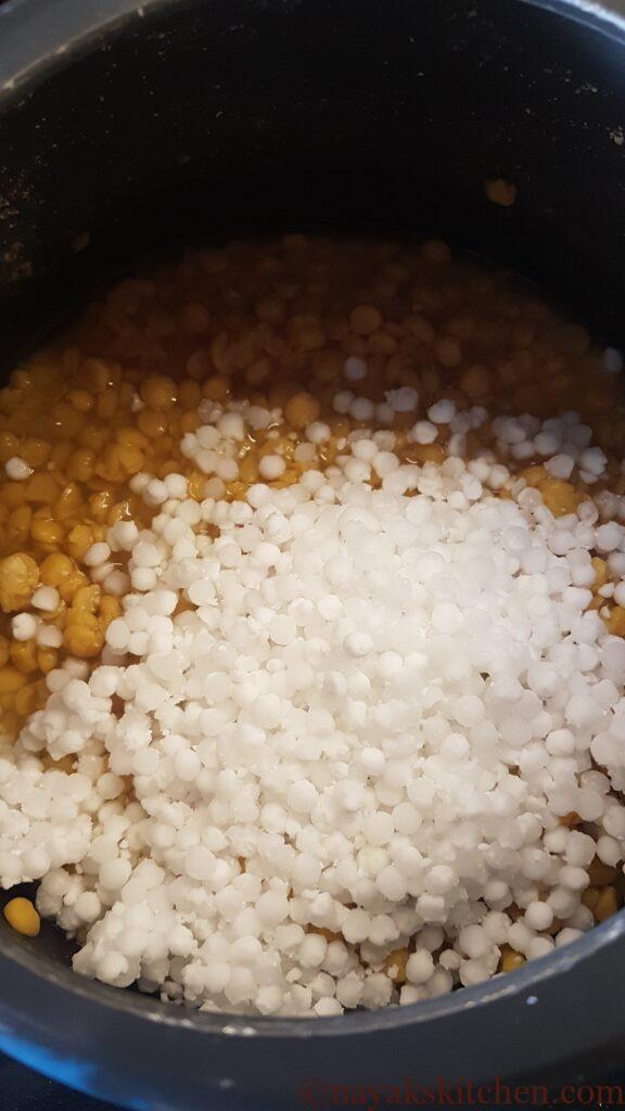 Adding sabudana to cooked chana dal
