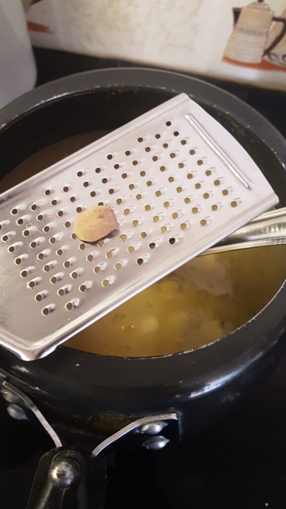 Adding grated nutmeg