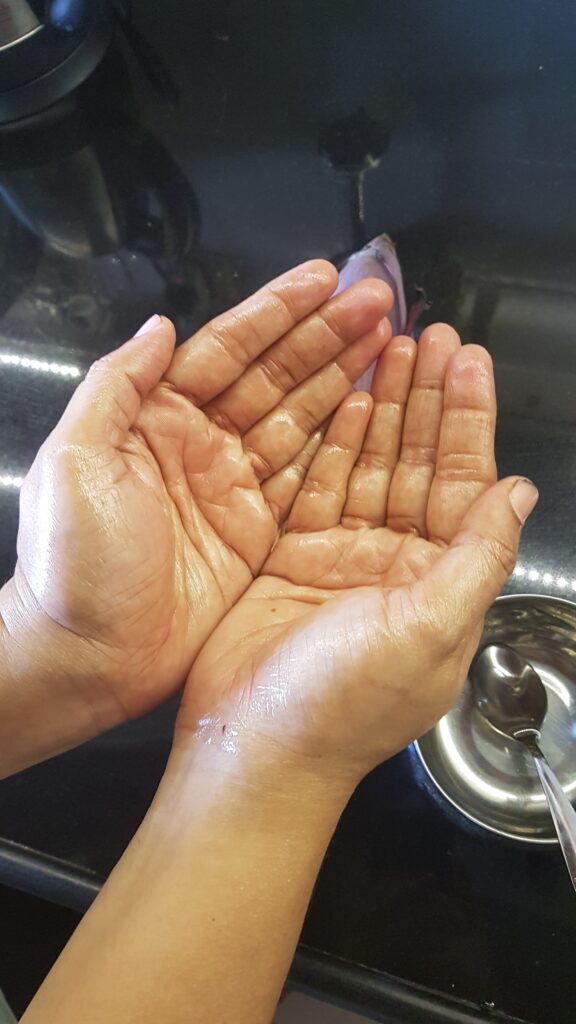 Applying oil to hands