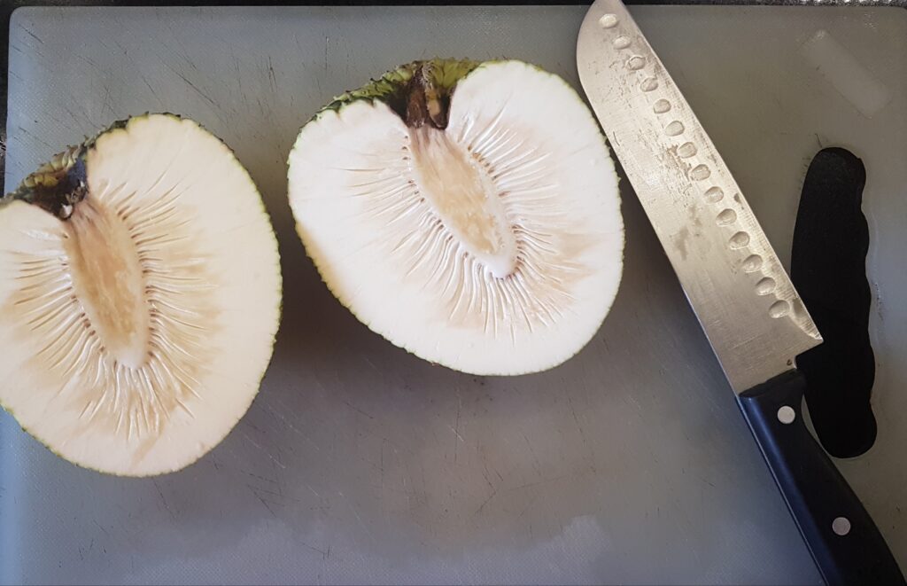 Cut the breadfruit into half