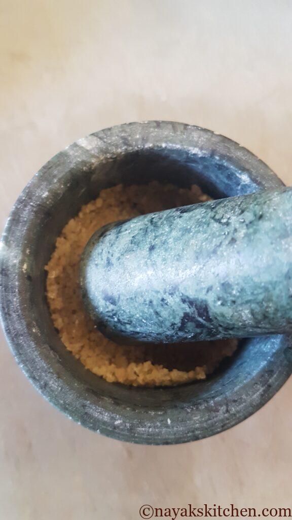 Crushing salt in a mortar pestle