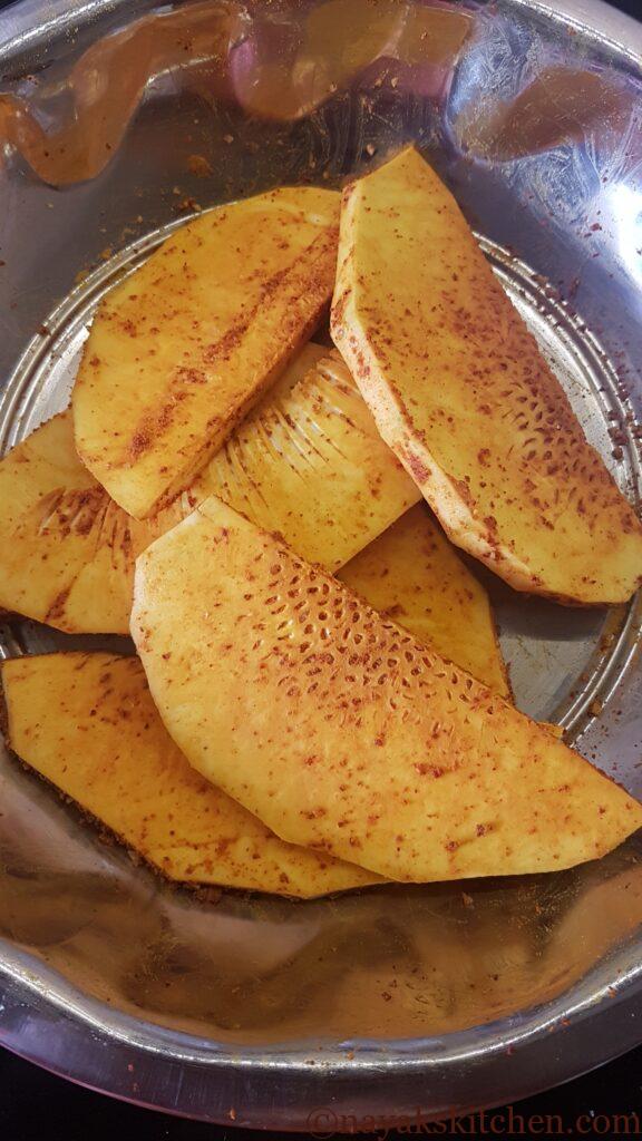 Mixing well to coat spice powders evenly.