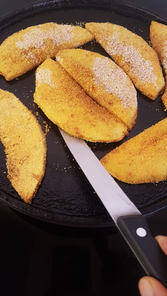 Flip breadfruit pieces to cook other side