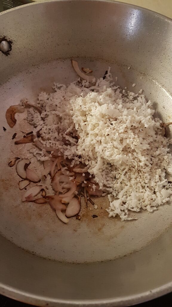 Adding grated coconut