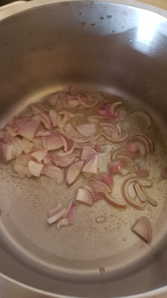 Frying onion in a deep bottomed pan