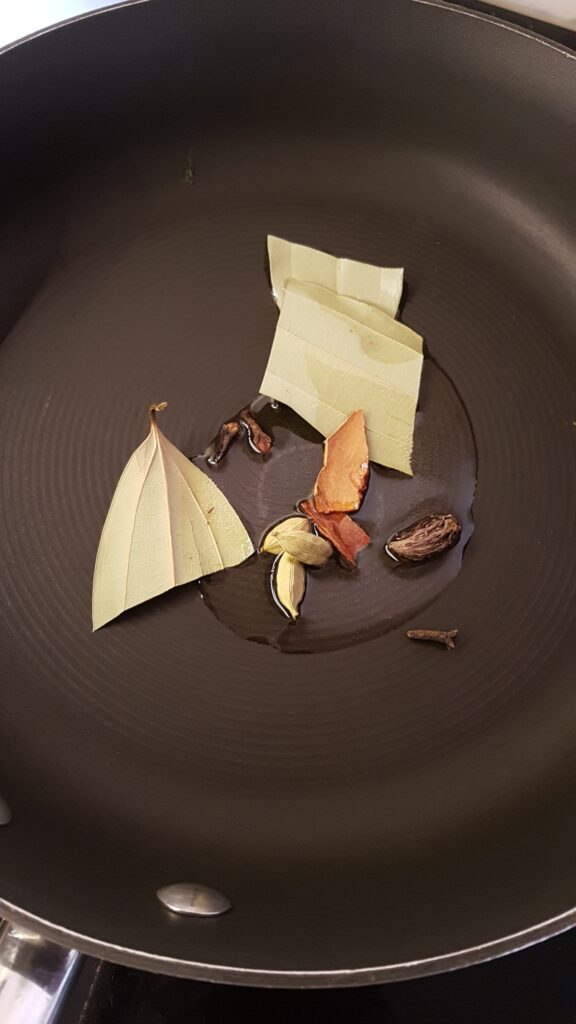 Heat oil and add spices