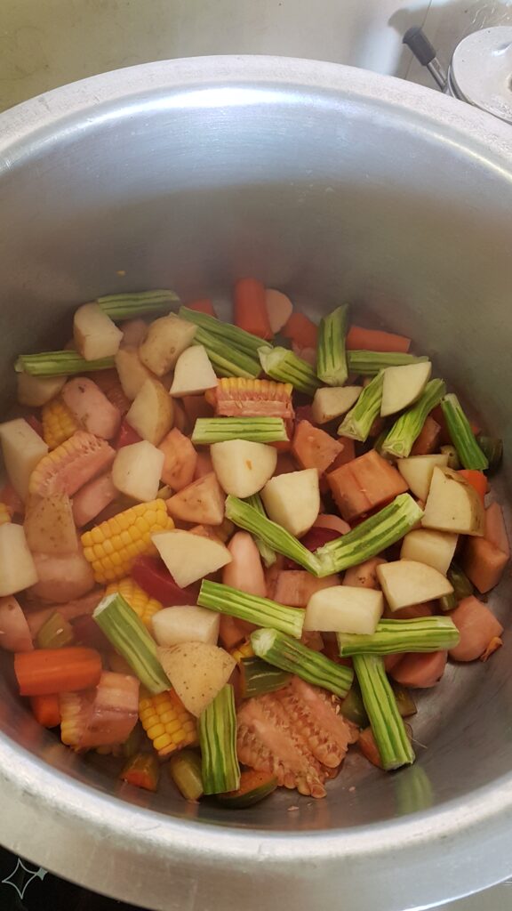 Adding drumsticks and potato