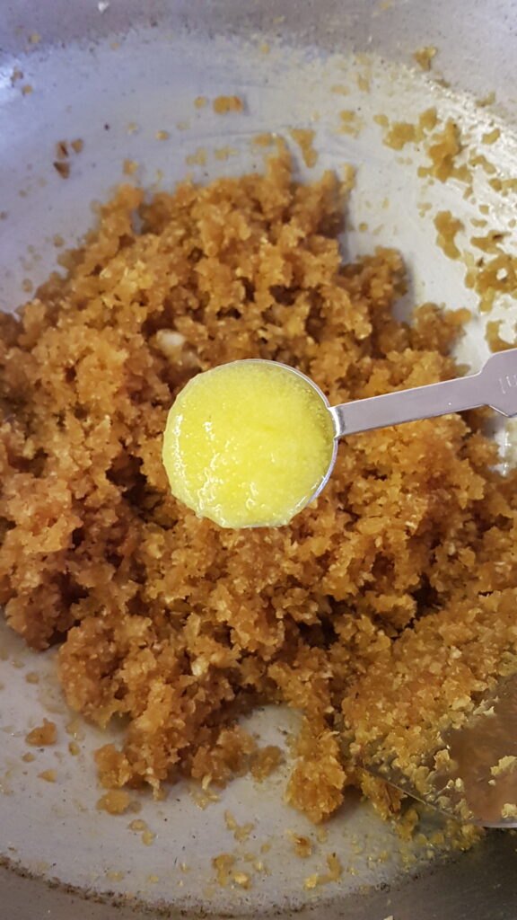 Adding ghee to stuffing