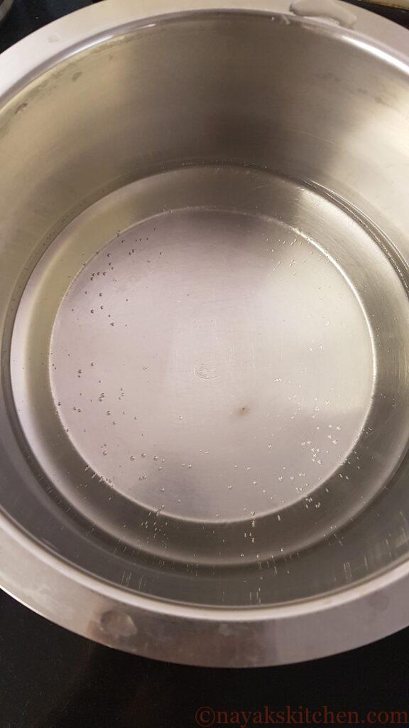 Heating water to prepare ukdiche modak