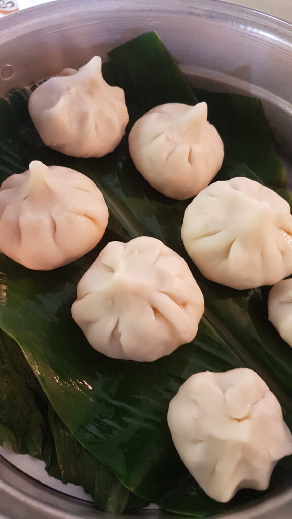 Placing the modak in the steamer
