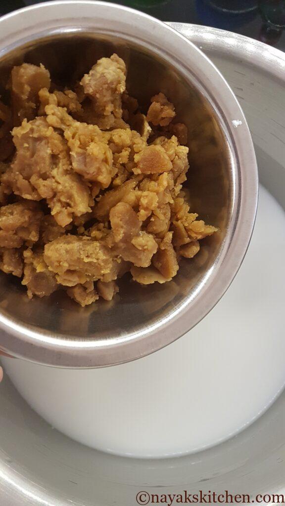 Adding jaggery to thin coconut milk