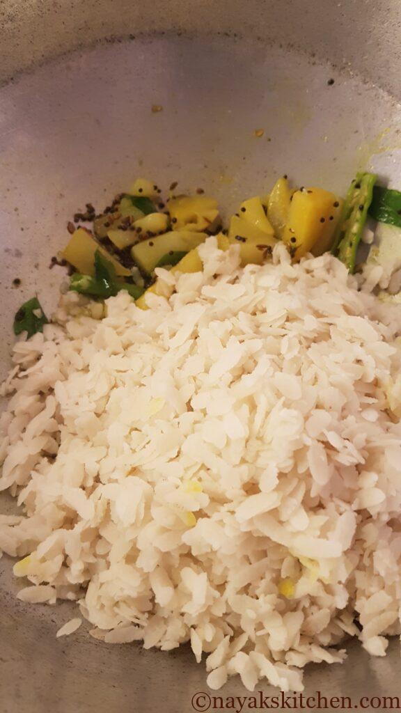 Adding washed poha