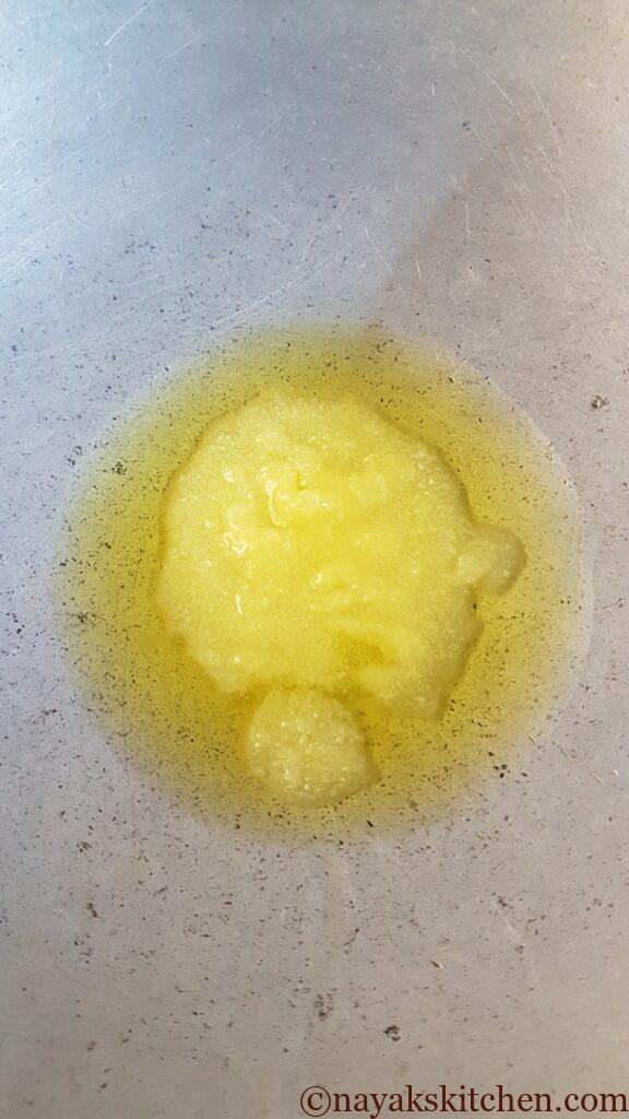 Heating ghee in a kadhai