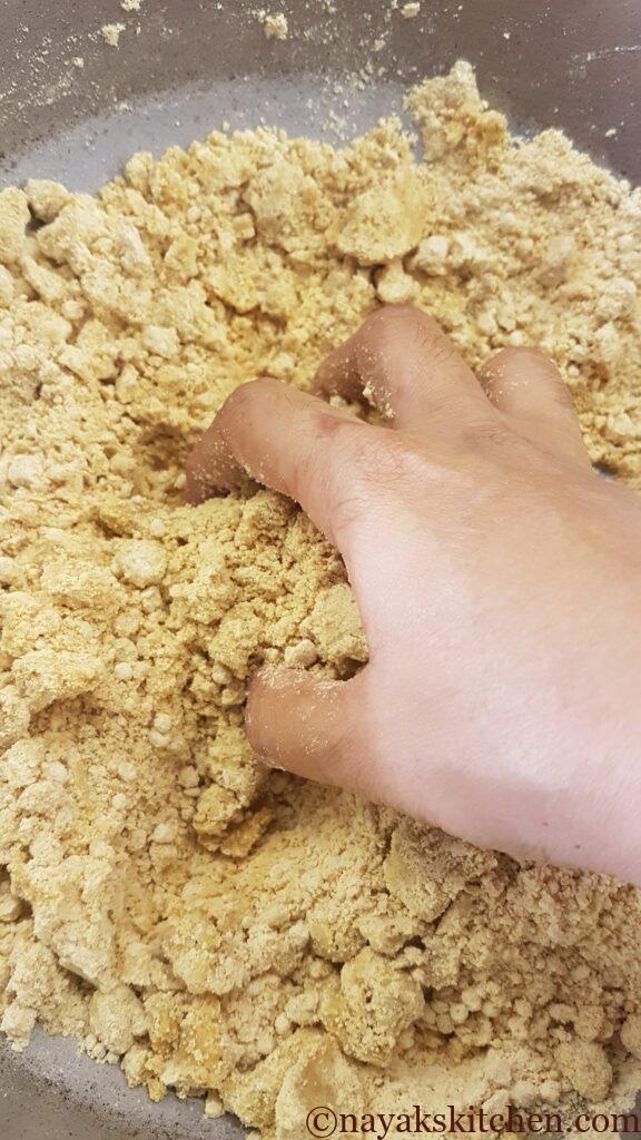 Breaking any lumps in flour