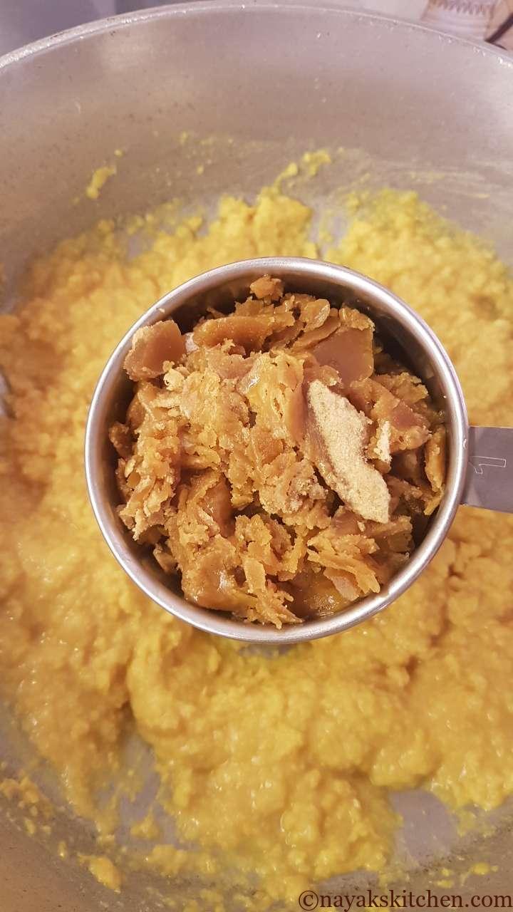 Adding jaggery to cooked dal