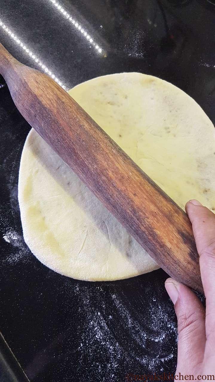 Rolling out the puran poli