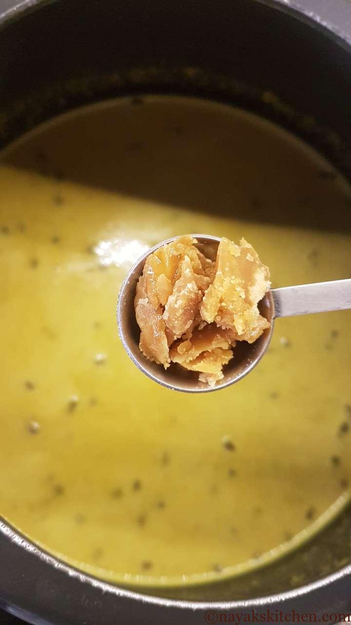 Adding jaggery to Mooga Gathi