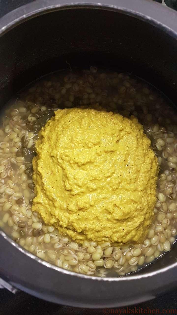 Adding ground paste to sprouted moong